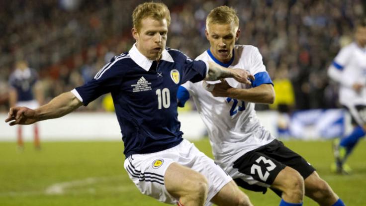 177441-scotlands-chris-burke-left-is-closed-down-by-taijo-teniste